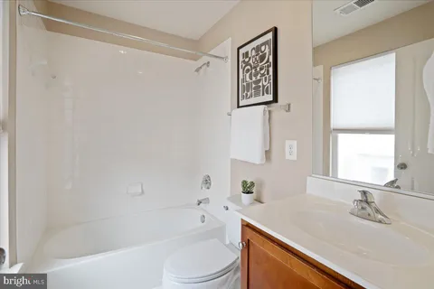 a kitchen with a table and chairs in it