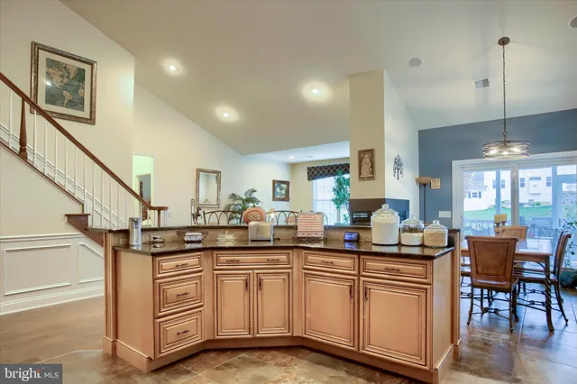 a view of a dining room with furniture wooden floor and a chandelier