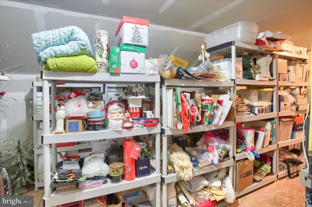 a bedroom with a bed and a potted plant