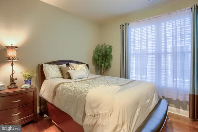 a living room with fireplace furniture and a wooden floor