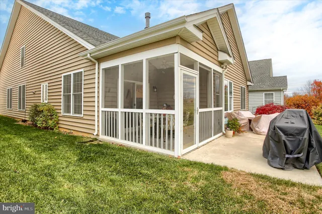 a large kitchen with a table and chairs