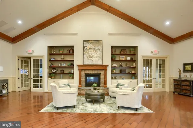 a view of a a dining room with furniture window and wooden floor