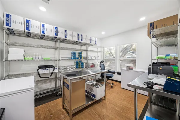 a kitchen with stainless steel appliances granite countertop a stove and a refrigerator