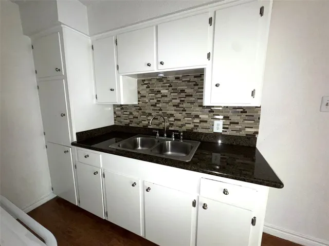 a close view of a stove a microwave and cabinets in the kitchen