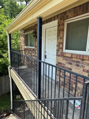a view of a house with a window and wooden floor