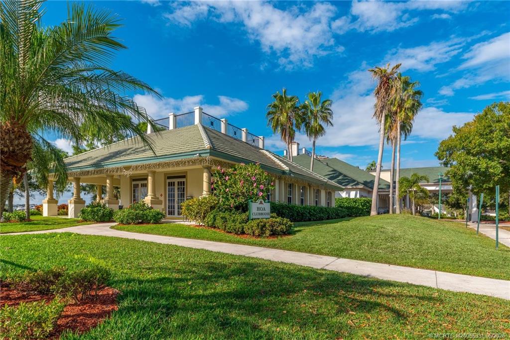 2216 Southeast Stonehaven Road Port St. Lucie, FL 34952 - Photo 66 of 67 a front view of a house with garden