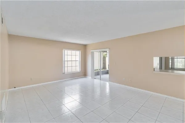 a view of an empty room with a window