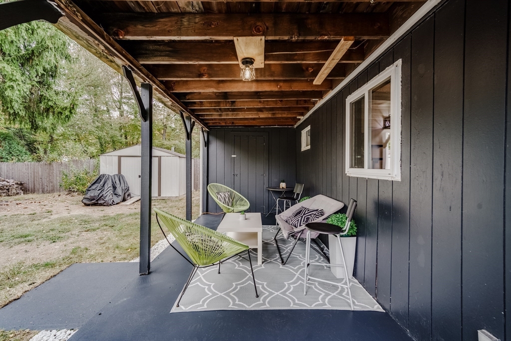 26 Groton Street Springfield, MA 01129 - Photo 17 of 24 a view of a porch with furniture and a yard