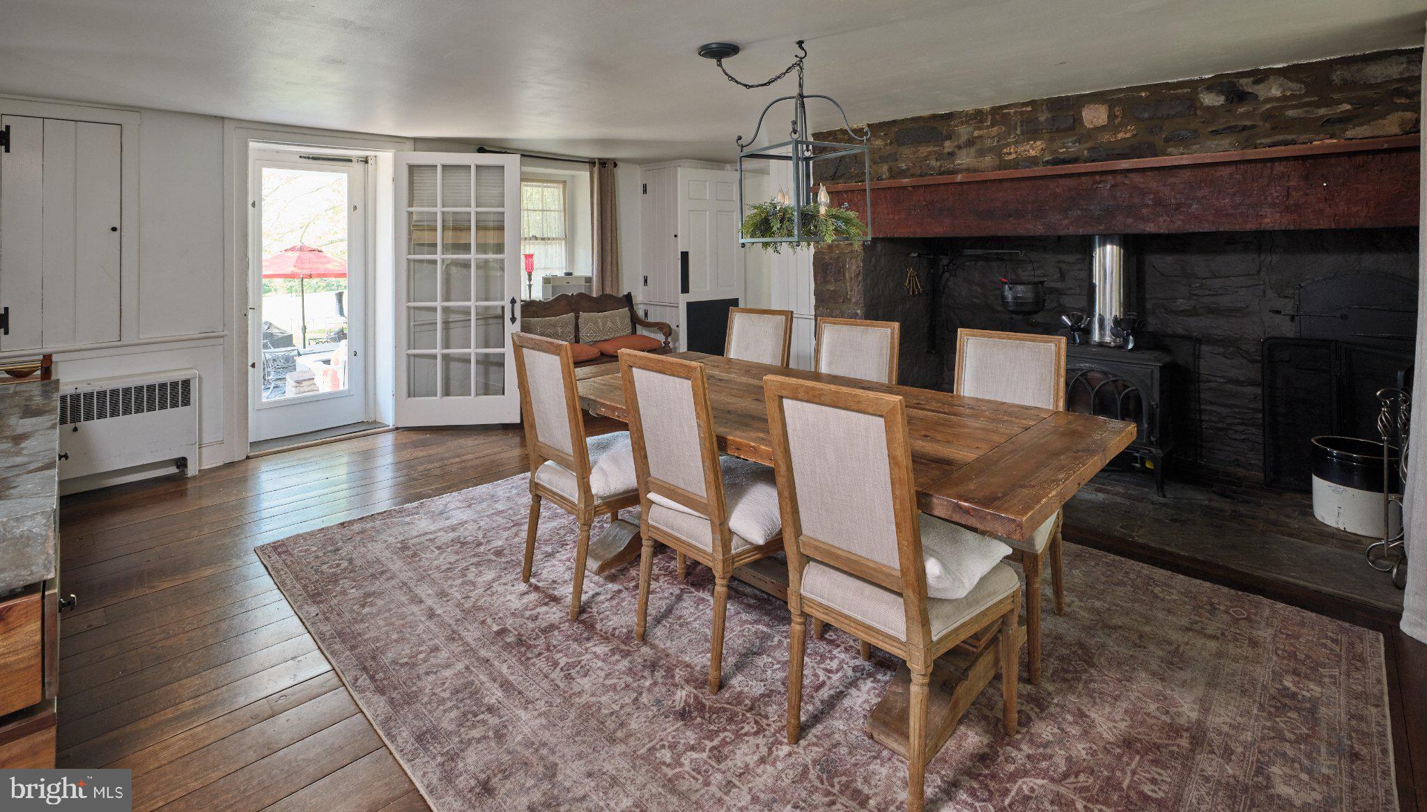 765 Swamp Road Newtown, PA 18940 - Photo 7 of 37 a dining room with a wooden table and chairs