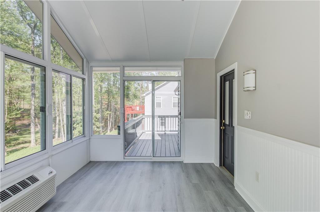 3220 Governors Court Duluth, GA 30096 - Photo 18 of 48 an empty room with wooden floor and windows