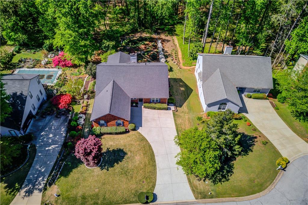 3220 Governors Court Duluth, GA 30096 - Photo 2 of 48 a view of a house with a yard and potted plants