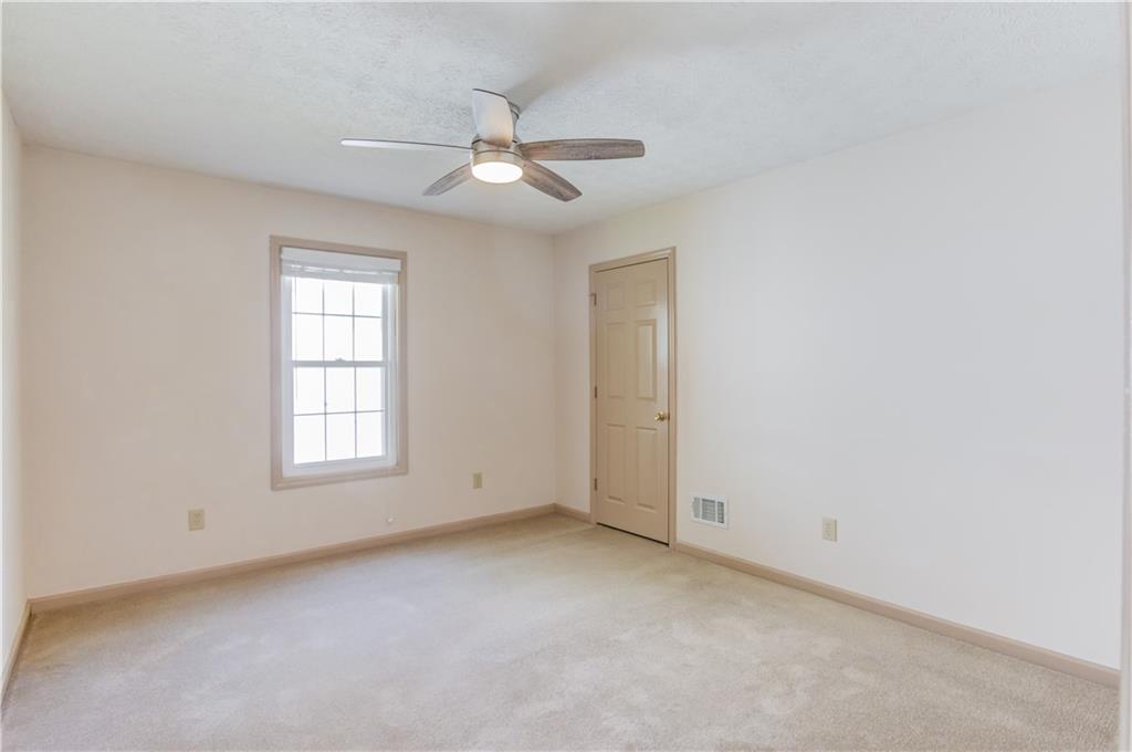 3220 Governors Court Duluth, GA 30096 - Photo 25 of 48 an empty room with windows and fan window