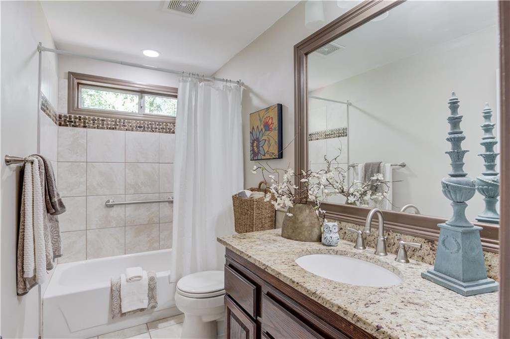 3220 Governors Court Duluth, GA 30096 - Photo 27 of 48 a bathroom with a granite countertop sink toilet and shower