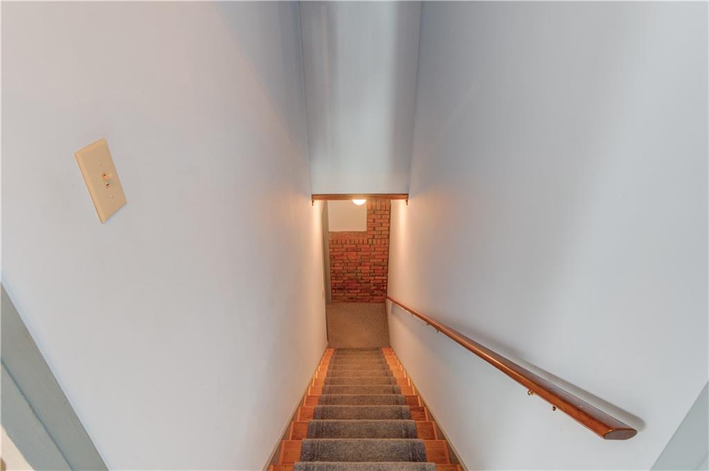 3220 Governors Court Duluth, GA 30096 - Photo 30 of 48 a view of a hallway with wooden floor and stairs