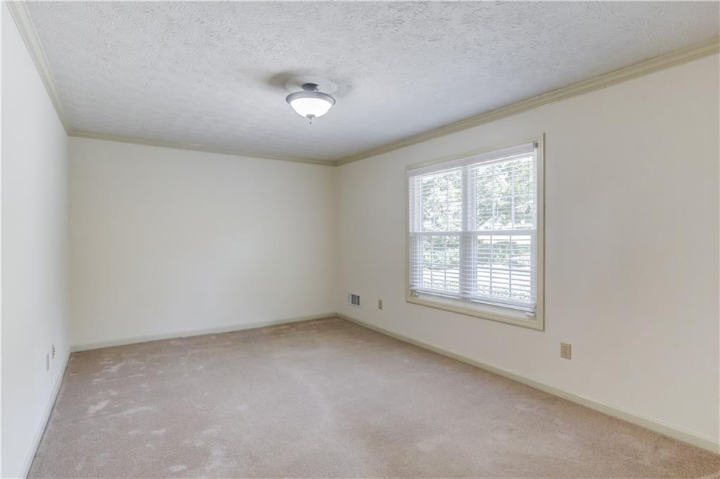 3220 Governors Court Duluth, GA 30096 - Photo 6 of 48 an empty room with a window