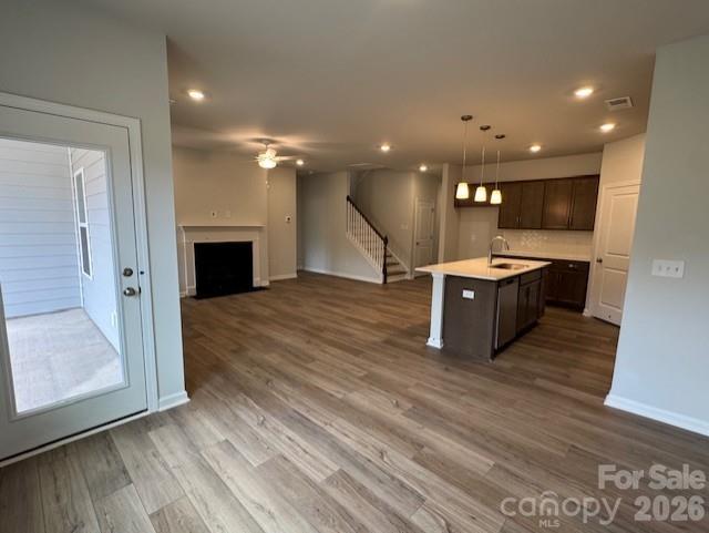 206 Rodeo Drive Shelby, NC 28150 - Photo 7 of 19 a open kitchen with stainless steel appliances kitchen island wooden floors and view living room
