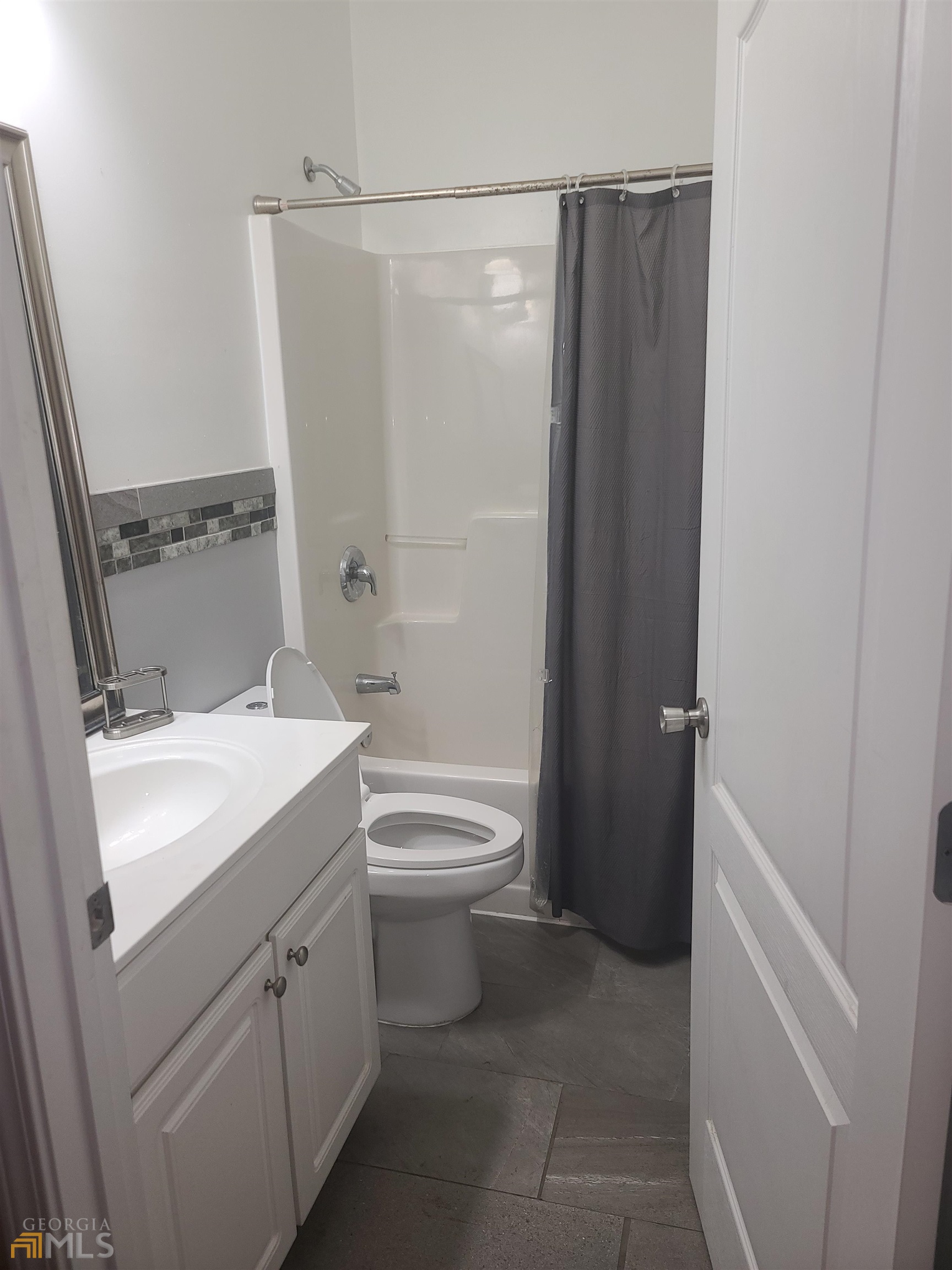 4857 Shae Court Powder Springs, GA 30127 - Photo 20 of 21 a bathroom with a sink a toilet and shower