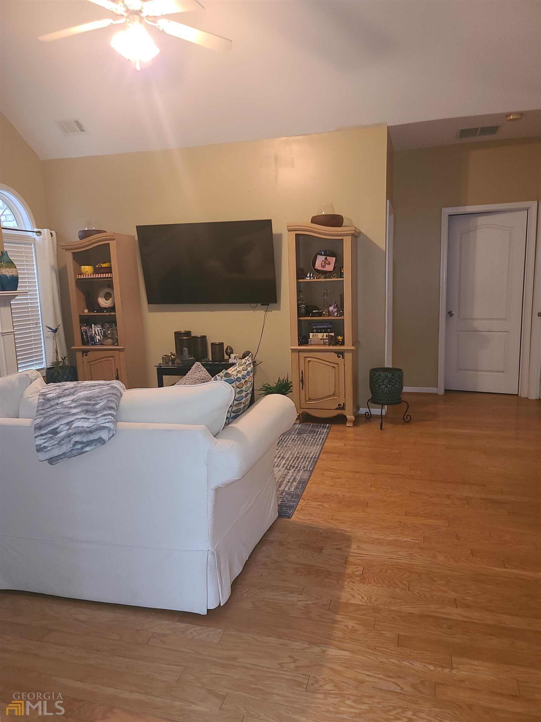 4857 Shae Court Powder Springs, GA 30127 - Photo 6 of 21 a living room with furniture and a flat screen tv