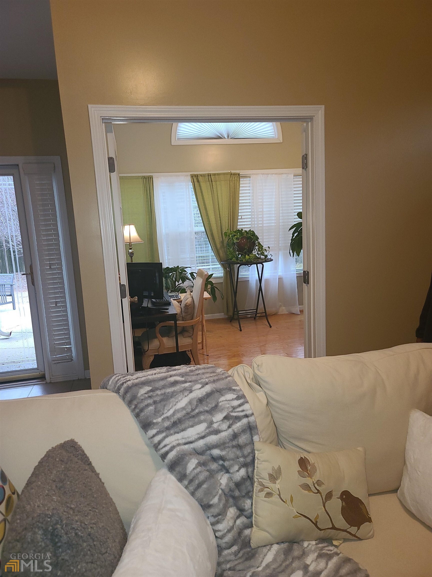 4857 Shae Court Powder Springs, GA 30127 - Photo 8 of 21 a bedroom with a bed a table and painting on the wall