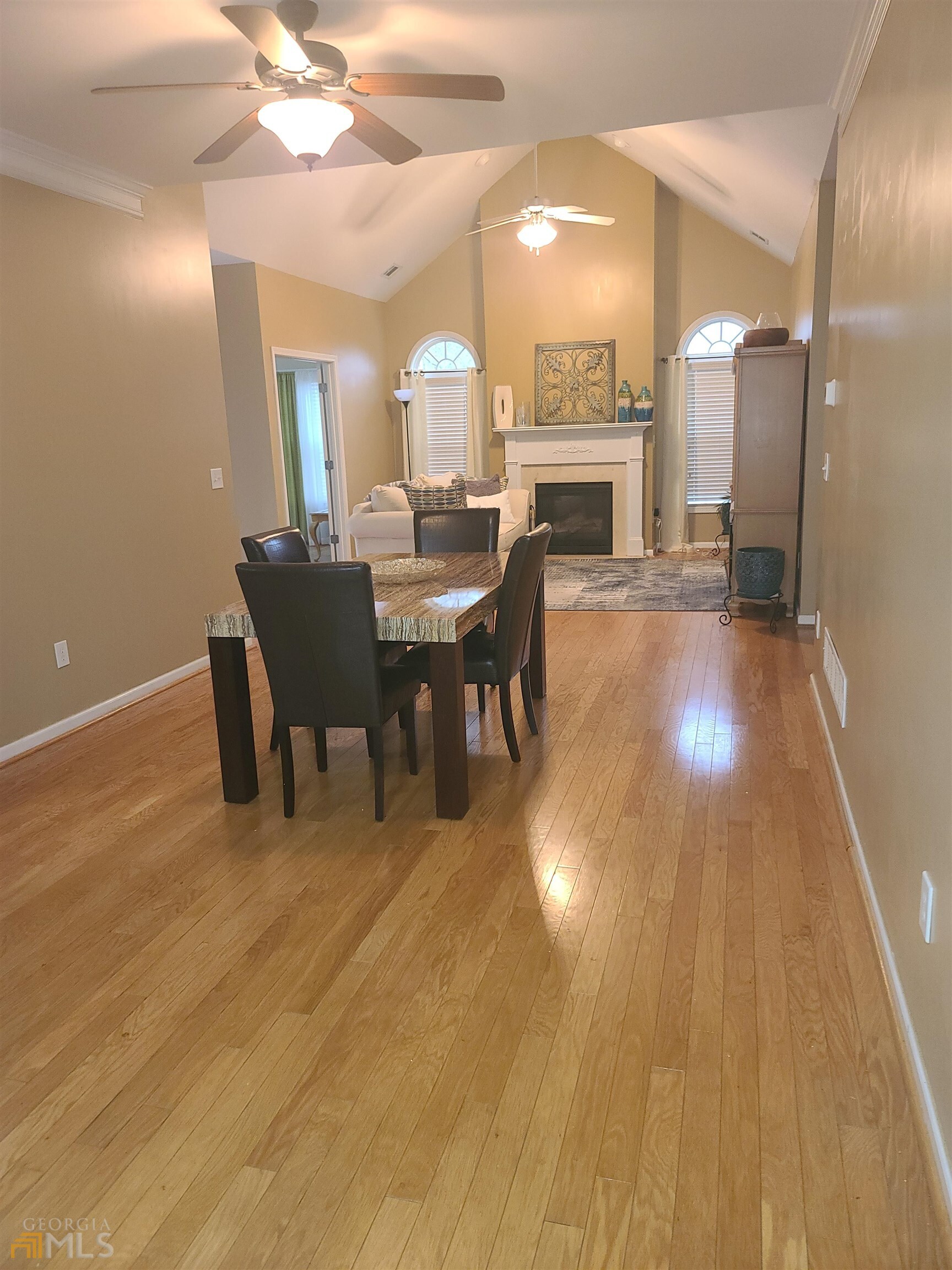 4857 Shae Court Powder Springs, GA 30127 - Photo 10 of 21 a view of a dining room with furniture and a chandelier