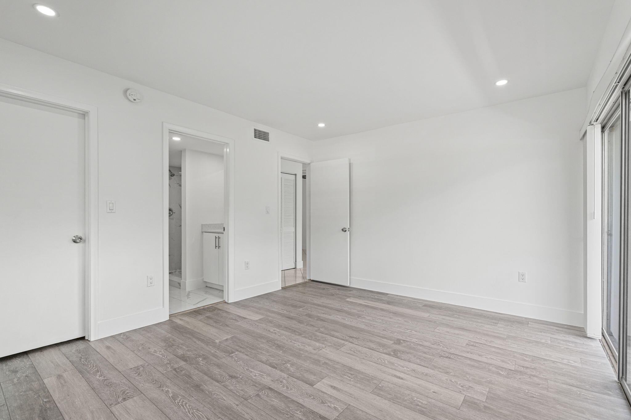 9227 Southwest 87th Avenue, Unit B1 Miami, FL 33176 - Photo 14 of 27 a view of an empty room with wooden floor