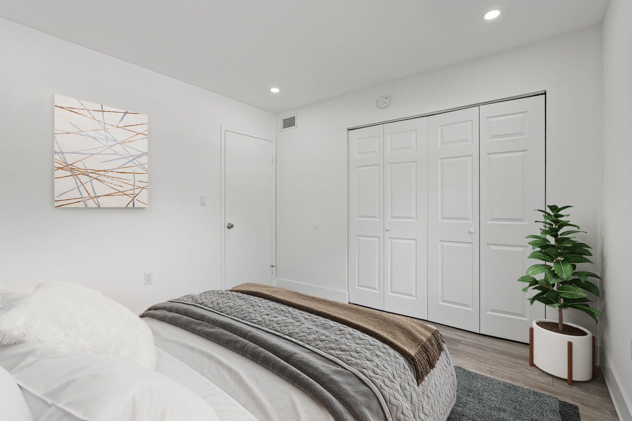 9227 Southwest 87th Avenue, Unit B1 Miami, FL 33176 - Photo 20 of 27 a bedroom with a bed and a potted plant