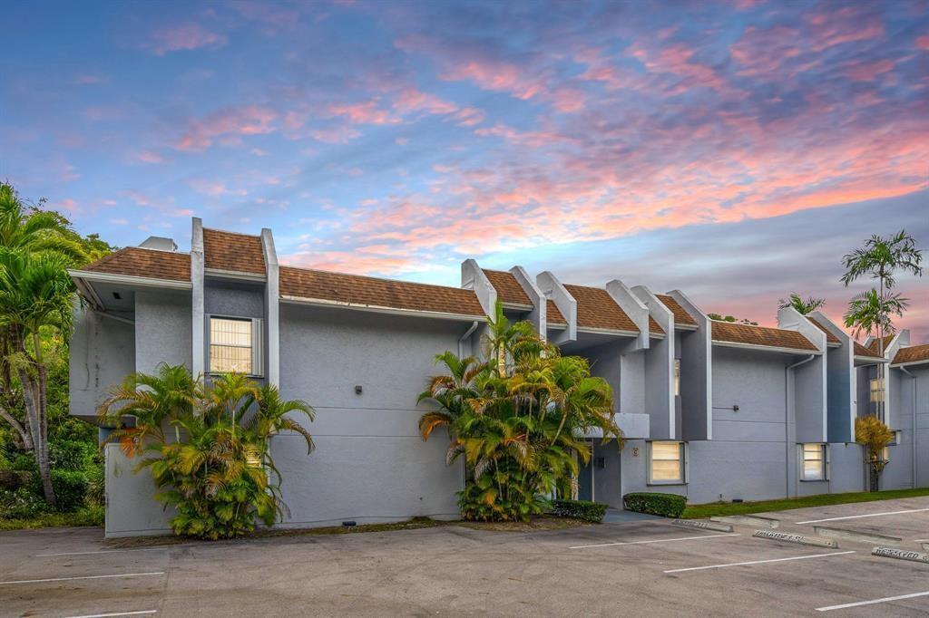 9227 Southwest 87th Avenue, Unit B1 Miami, FL 33176 - Photo 27 of 27 a front view of a house with garden