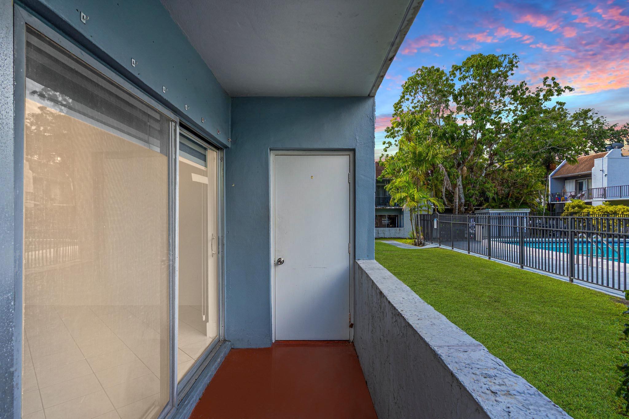 9227 Southwest 87th Avenue, Unit B1 Miami, FL 33176 - Photo 4 of 27 a balcony with view of an outdoor space