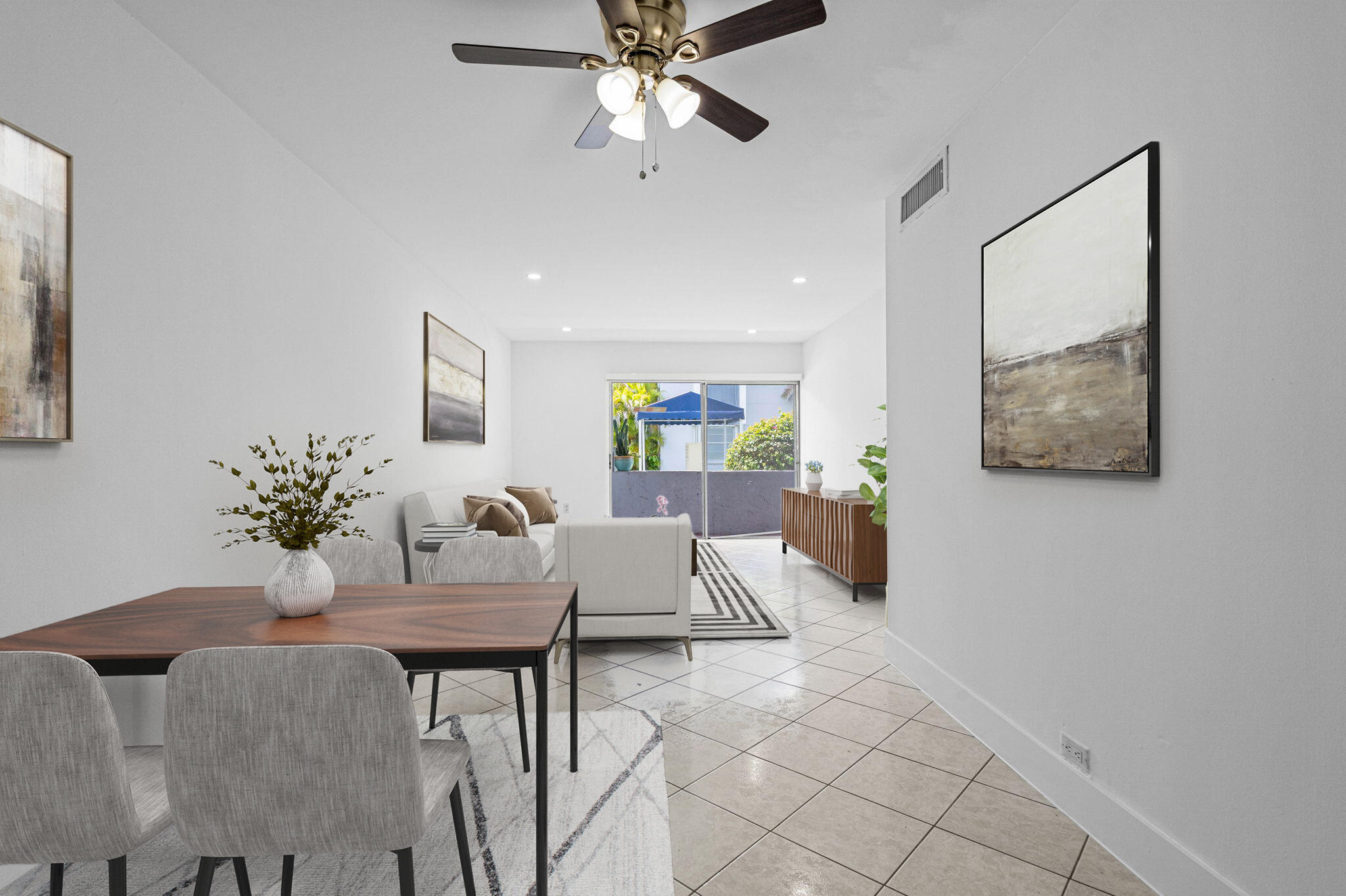 9227 Southwest 87th Avenue, Unit B1 Miami, FL 33176 - Photo 9 of 27 a living room with furniture and a chandelier