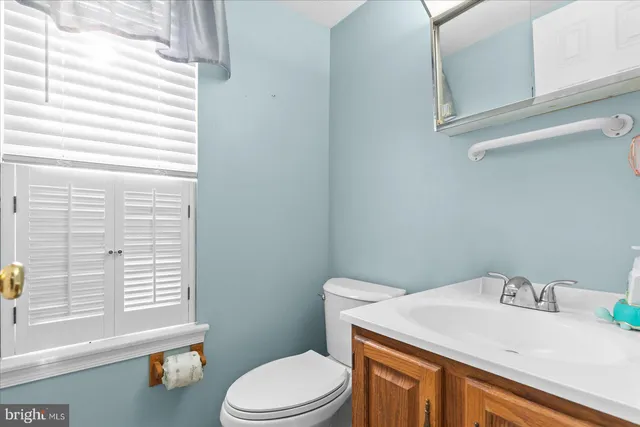 a bathroom with a sink a toilet and tub