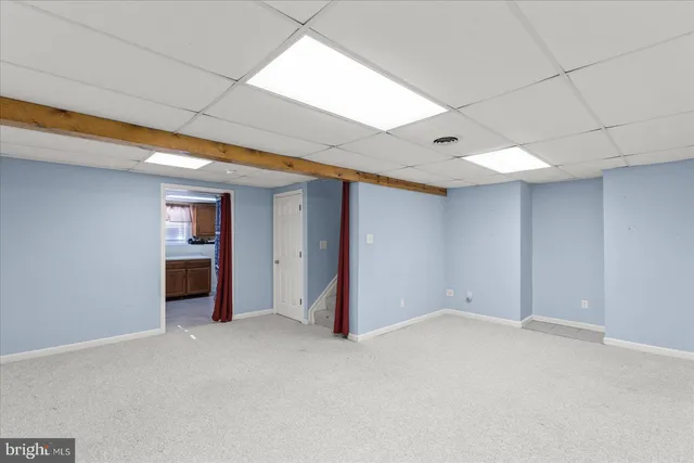a utility room with cabinets dryer and washer