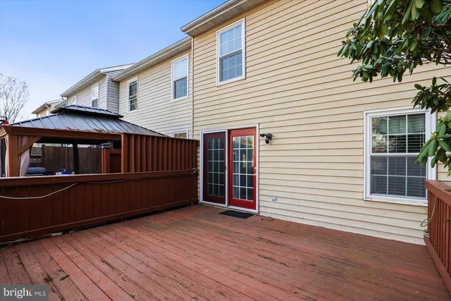 a terrace with wooden floor and fence