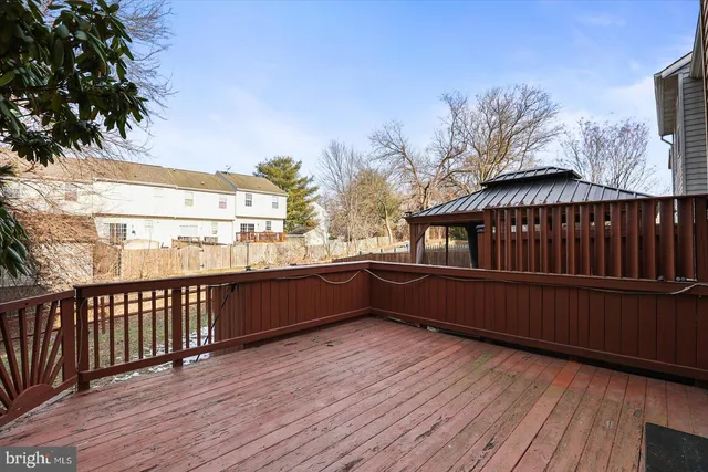 a view of deck with wooden floor and fence