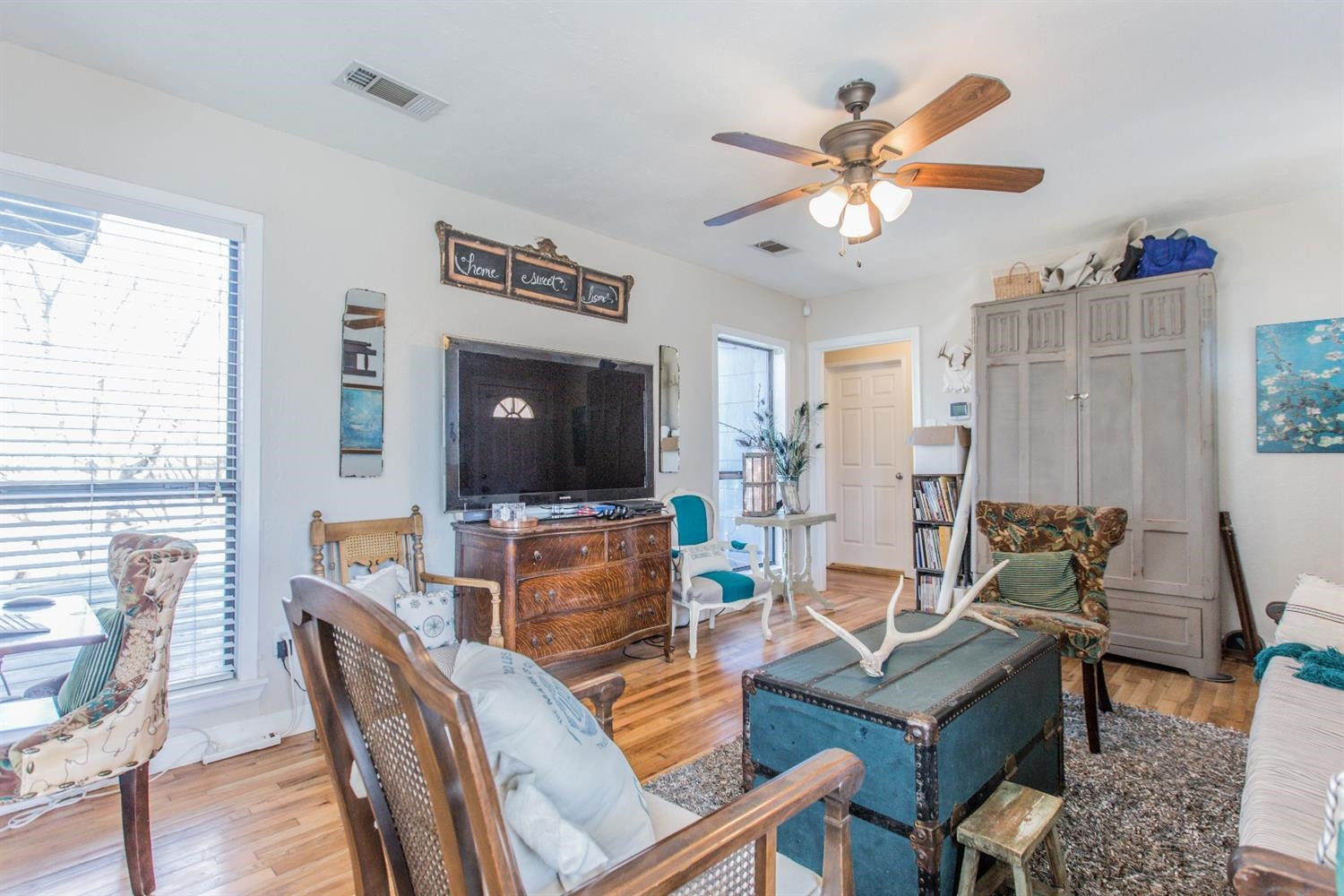 2806 30th Street Lubbock, TX 79410 - Photo 2 of 10 a living room with furniture a flat screen tv and a window