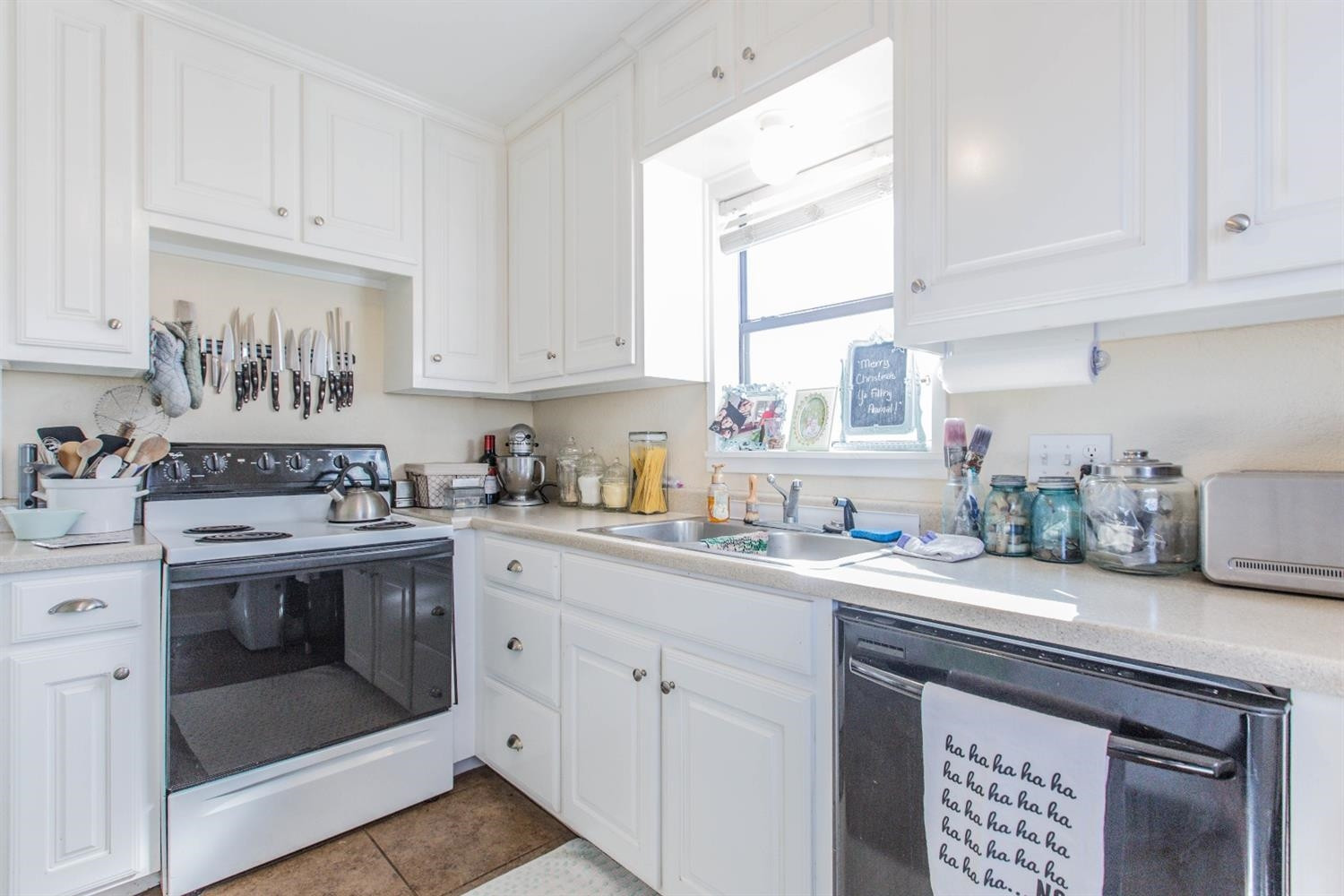 2806 30th Street Lubbock, TX 79410 - Photo 3 of 10 a kitchen with stainless steel appliances granite countertop a sink stove and cabinets