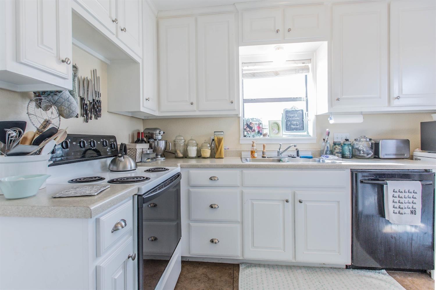 2806 30th Street Lubbock, TX 79410 - Photo 5 of 10 a kitchen with stainless steel appliances granite countertop a sink stove and cabinets