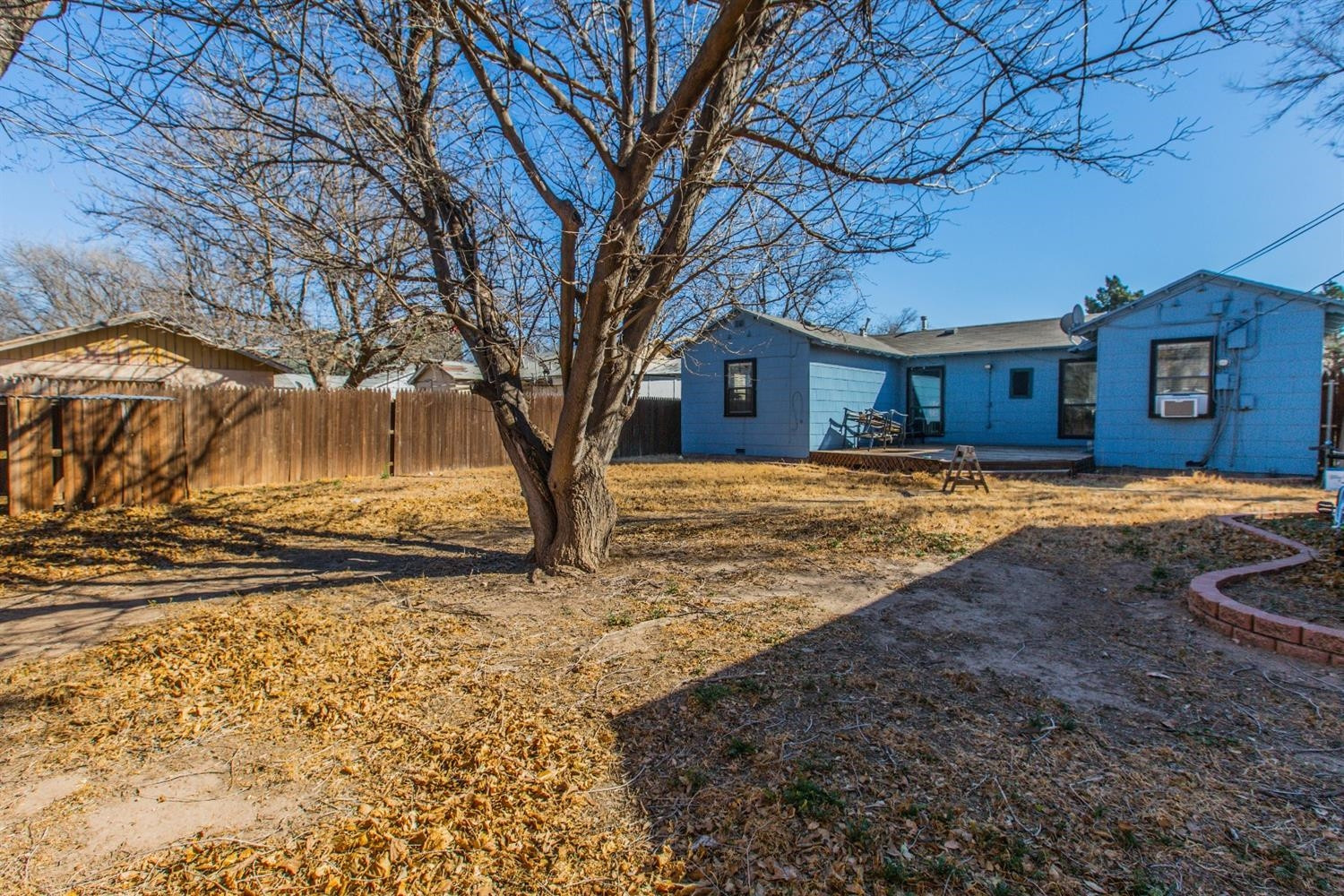 2806 30th Street Lubbock, TX 79410 - Photo 10 of 10 a view of a yard with a large tree