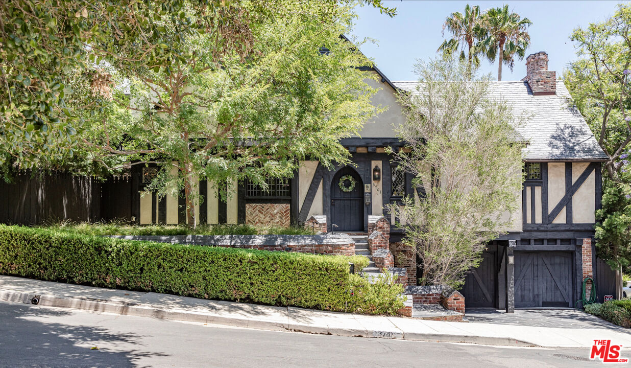 3701 Shannon Road Los Angeles, CA 90027 - Photo 1 of 54 front view of a house with a tree