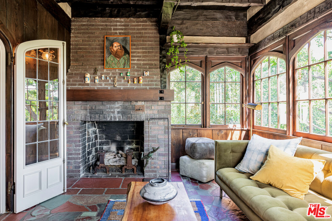 3701 Shannon Road Los Angeles, CA 90027 - Photo 16 of 54 a living room with furniture and a fireplace