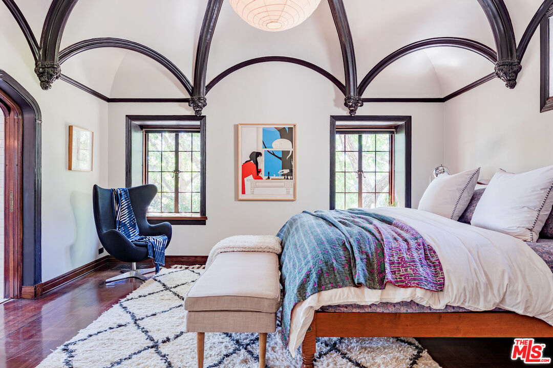 3701 Shannon Road Los Angeles, CA 90027 - Photo 17 of 54 a bedroom with a bed and a large mirror on dresser