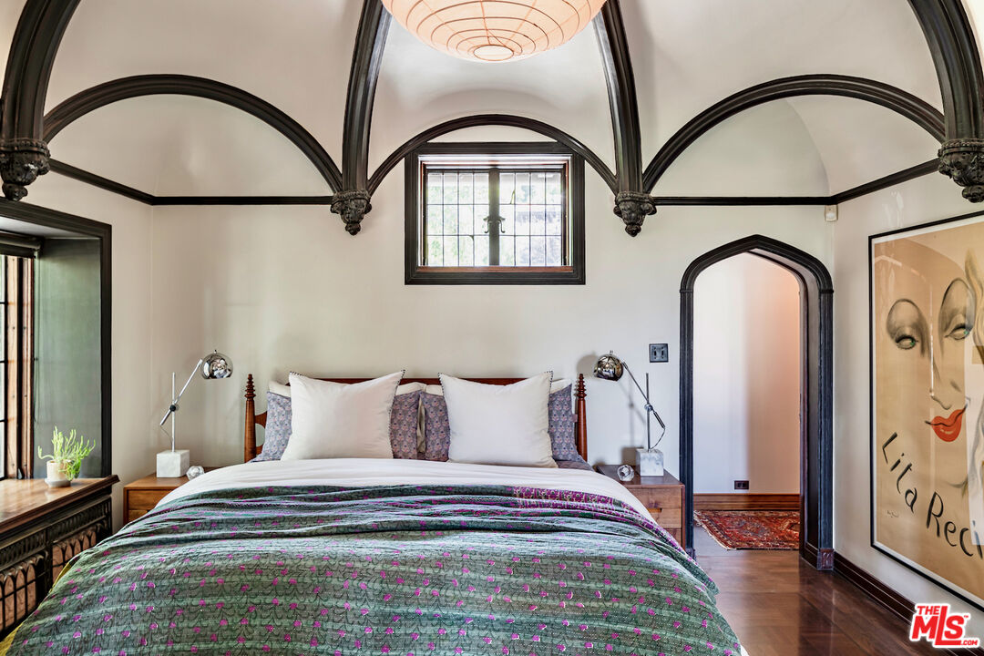 3701 Shannon Road Los Angeles, CA 90027 - Photo 18 of 54 a bedroom with a bed and a painting on the wall