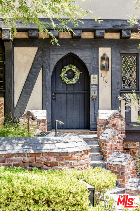 3701 Shannon Road Los Angeles, CA 90027 - Photo 2 of 54 a front view of a house with garden