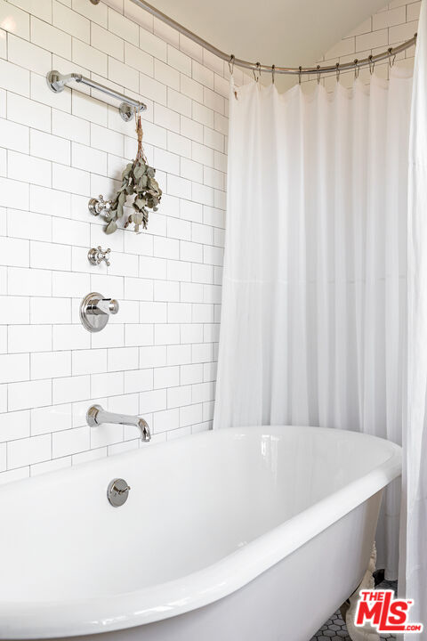 3701 Shannon Road Los Angeles, CA 90027 - Photo 23 of 54 a bathroom with a bathtub and shower