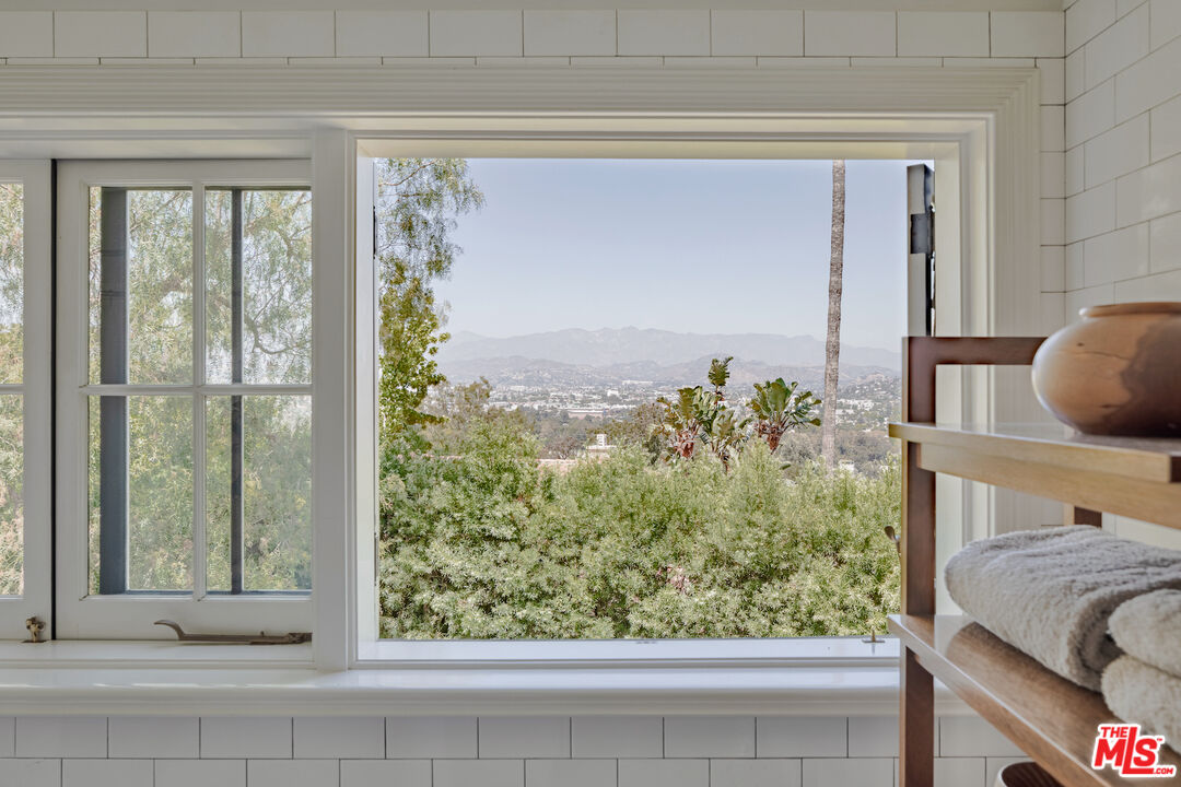 3701 Shannon Road Los Angeles, CA 90027 - Photo 24 of 54 a bedroom with a bed and a large window
