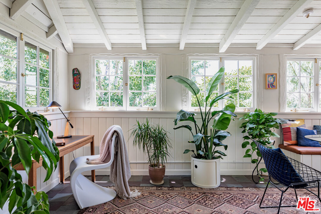 3701 Shannon Road Los Angeles, CA 90027 - Photo 26 of 54 a dining room with furniture and a potted plant