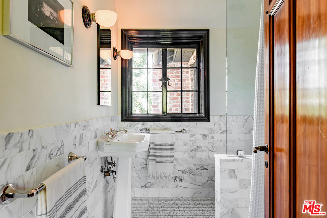 3701 Shannon Road Los Angeles, CA 90027 - Photo 29 of 54 a bathroom with a bathtub and shower