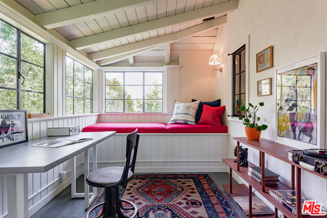 3701 Shannon Road Los Angeles, CA 90027 - Photo 32 of 54 a room with a bed and a table with rug