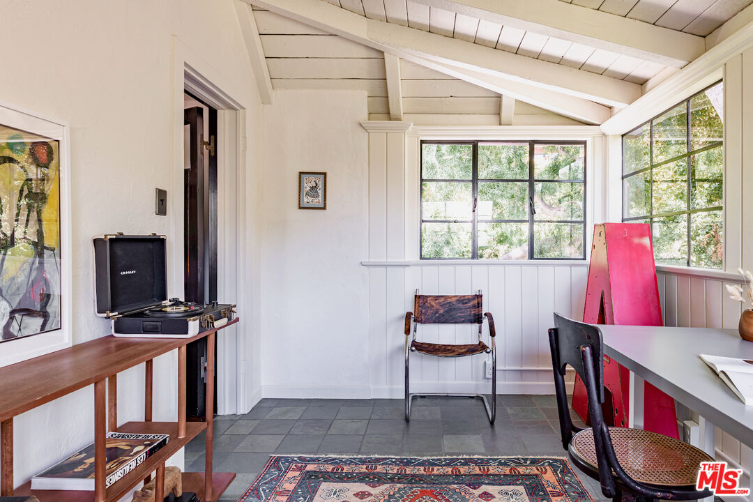 3701 Shannon Road Los Angeles, CA 90027 - Photo 33 of 54 a living room with furniture a flat screen tv and a window