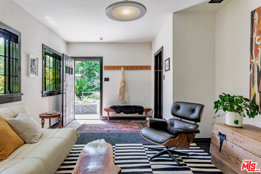 3701 Shannon Road Los Angeles, CA 90027 - Photo 40 of 54 a living room with furniture and a large window