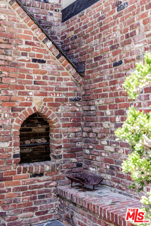 3701 Shannon Road Los Angeles, CA 90027 - Photo 51 of 54 a view of a fireplace with wooden floor